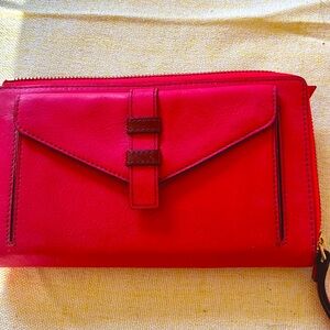 Red Leather Clutch with Flap Closure and Sleek Design